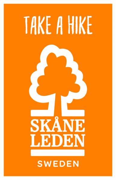 Orange patch with Sk&aring;neleden's logo